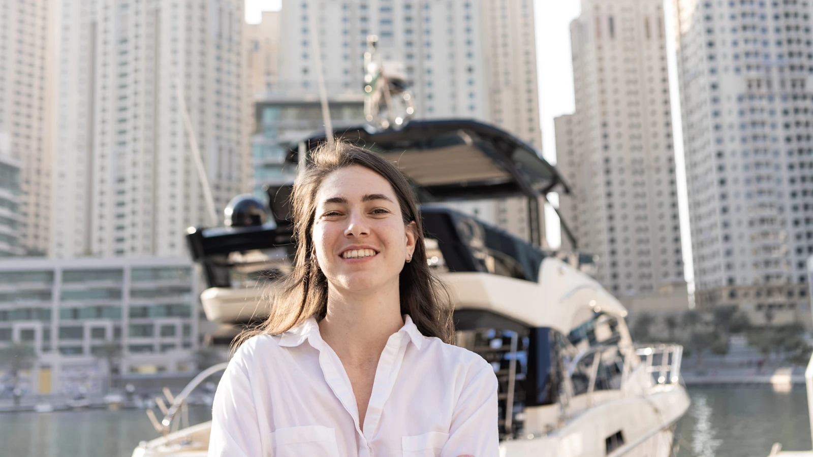 A smiling founder at Dubai Marina